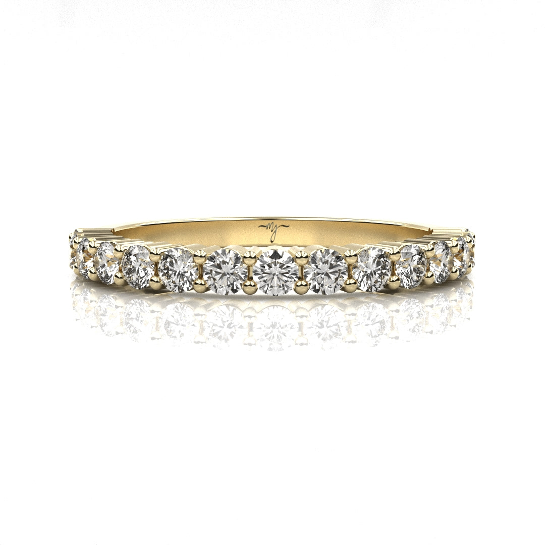 Gold ring with diamonds on a white background