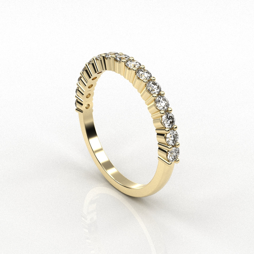 Gold ring with diamond accents on a white background