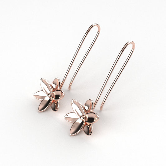 Rose gold floral earrings on a white background