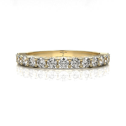Gold ring with diamonds on a white background