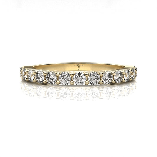 Gold ring with diamonds on a white background