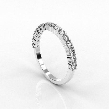 white gold ring with diamond accents on a white background