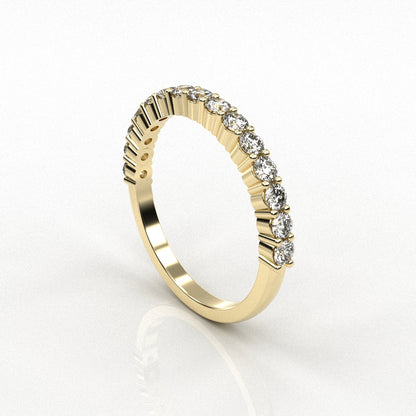 Gold ring with diamond accents on a white background